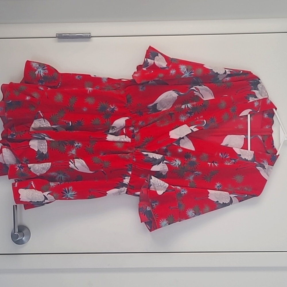 red romper with swans